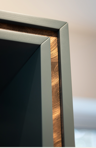 close-up of triple tier frame with copped detail on the centre layer