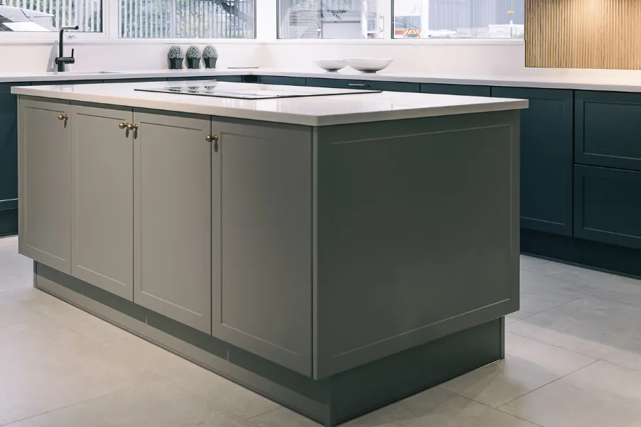 Rectangular grey kitchen island in kitchen showroom in Chichester