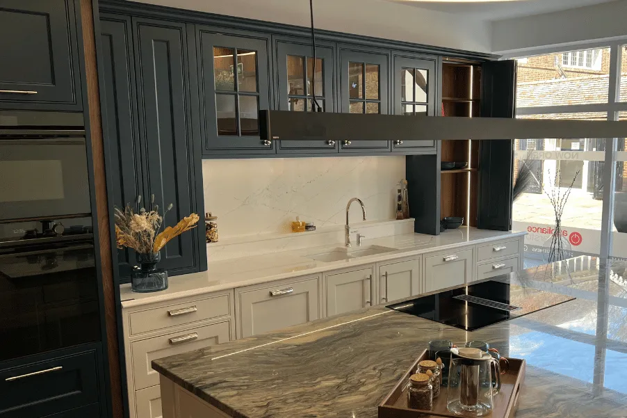 Stoneham Kitchen display with dark blue and light grey cabinetry in kitchen showroom in Rochester