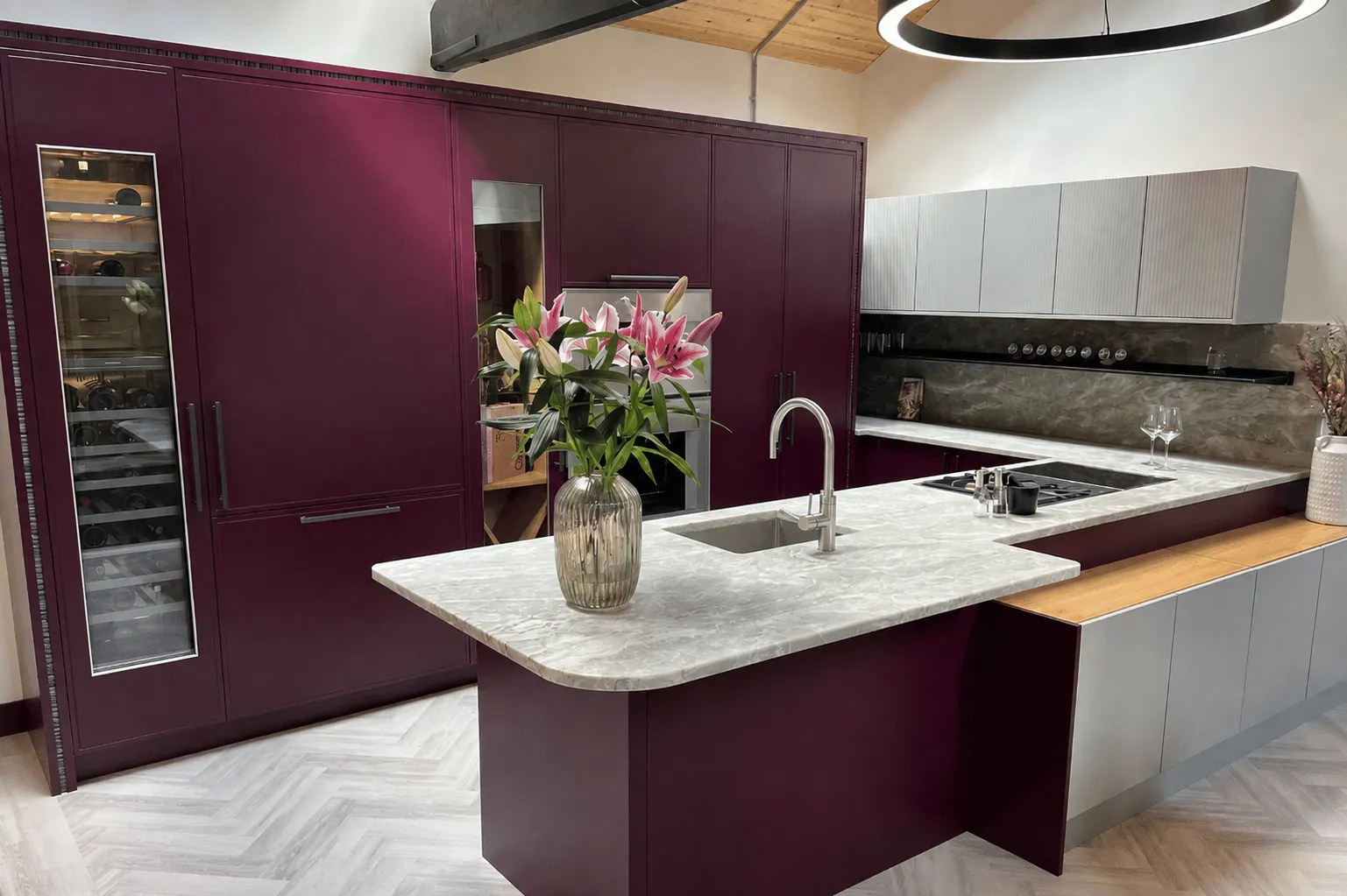 burgundy Stoneham Kitchen display in kitchen showroom in Rochester