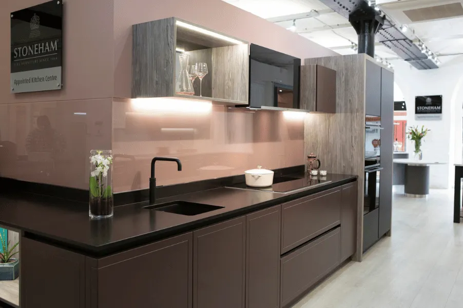 pink and brown handleless Stoneham Kitchen in the Gardiner Haskins kitchen showroom in Bristol