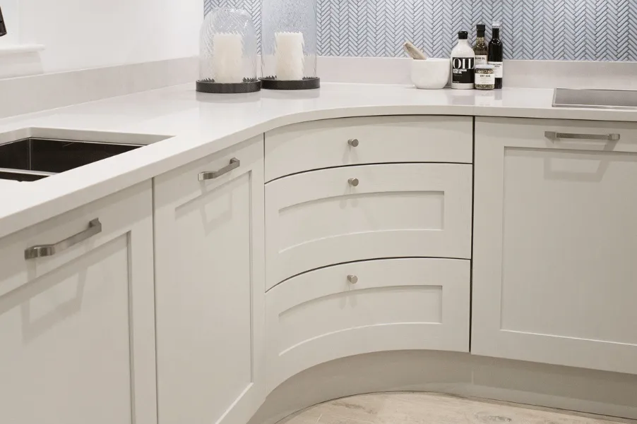 cashmere coloured curved kitchen cabinet in kitchen showroom in Essex