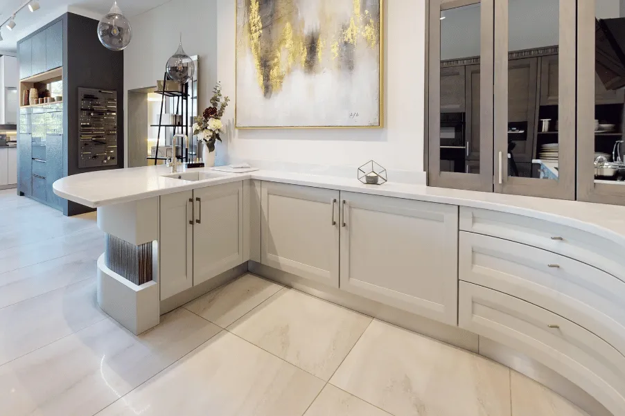 Culina-and-balneo-cheltenham-showroom-curved-cabinetry-sept-2026 Light neutral curved cabinetry with small peninsula