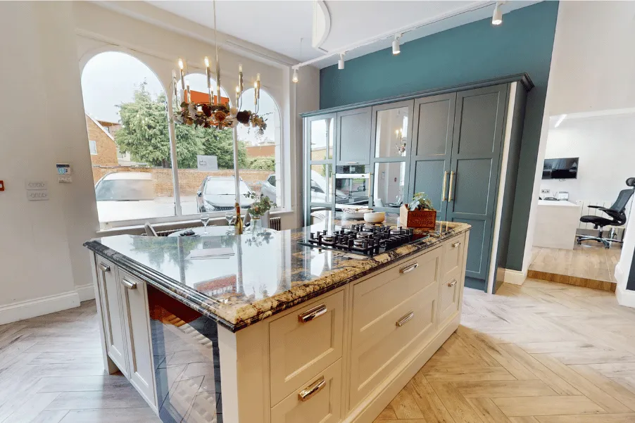 cream kitchen with dark veined worktop and integrated wine cooler