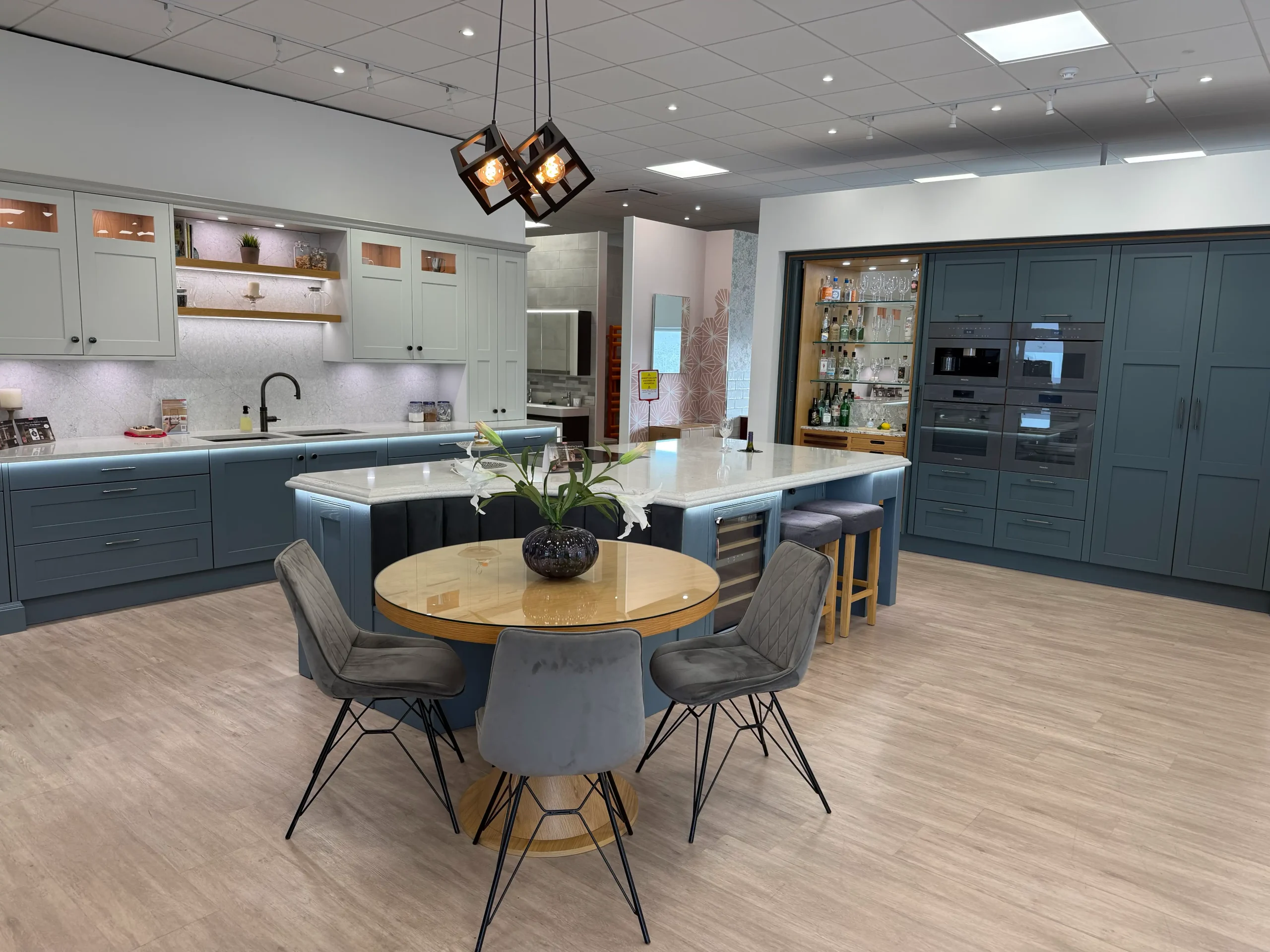 Kitchen island with booth seating and breakfast bar stools
