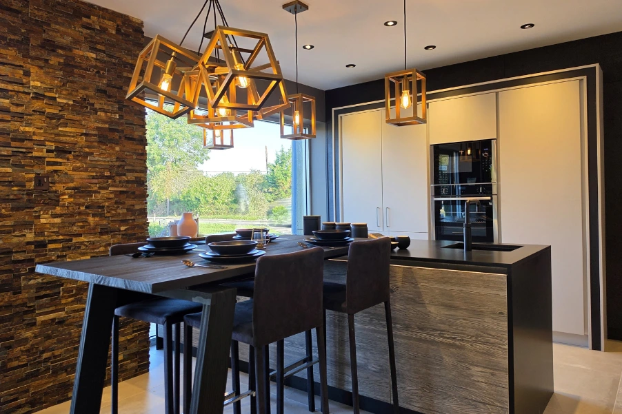 contemporary industrial kitchen with island and tall wooden dining table