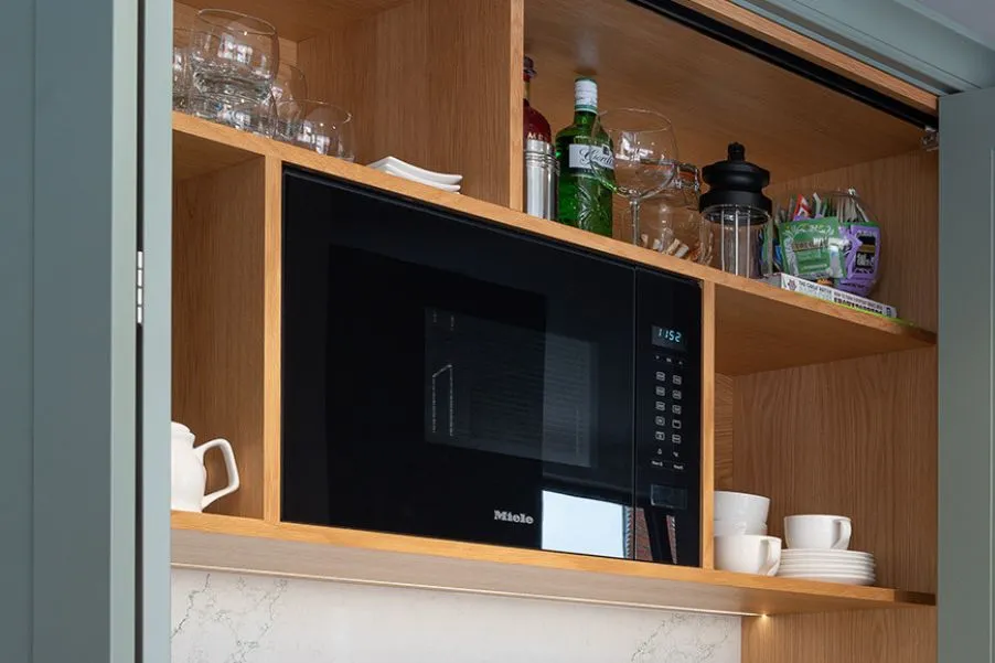 Microwave integrated into kitchen cabinetry