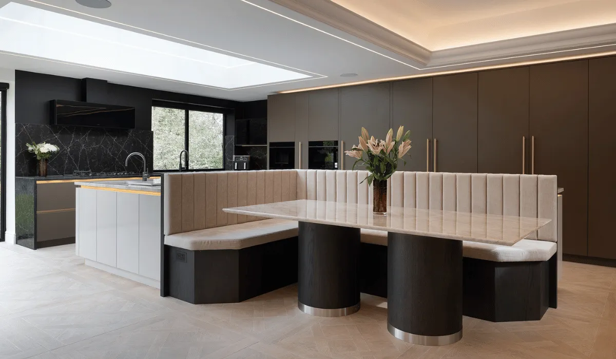 Contemporary brown kitchen with large kitchen island and L-shaped booth seating