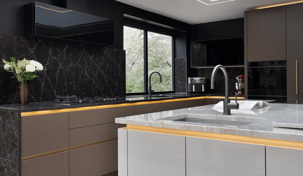 contemporary kitchen with high gloss cabinets on island and dark veining worktop