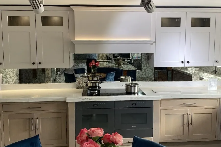 Neutral shaker kitchen with mirrored splashback
