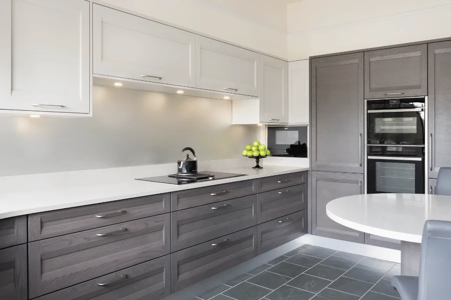 Classic Stoneham kitchen display with white and wooden cabinets.