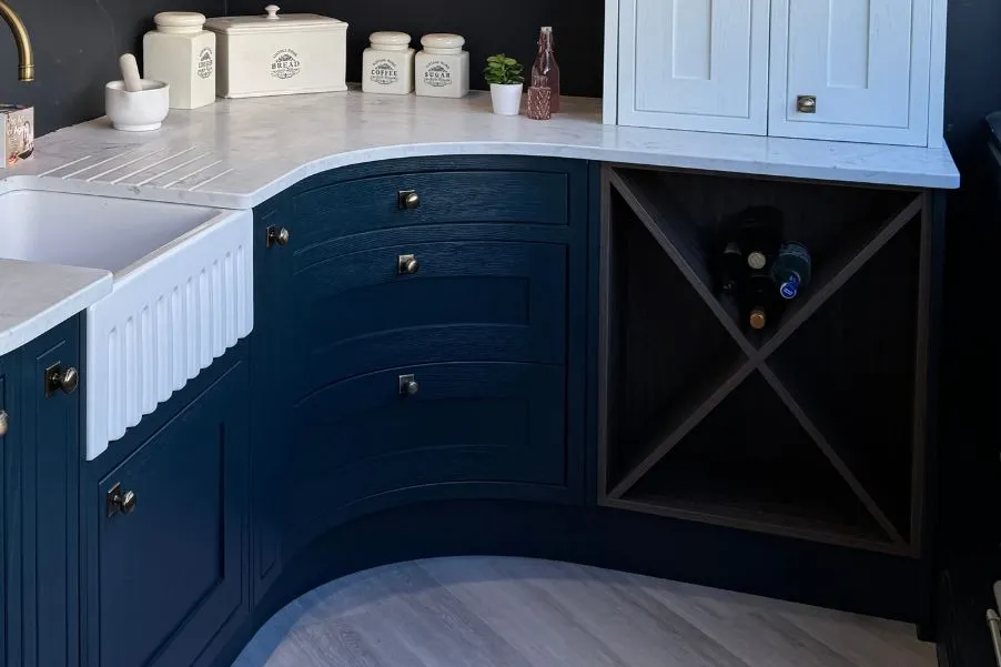 Cruciform wooden wine storage in blue kitchen