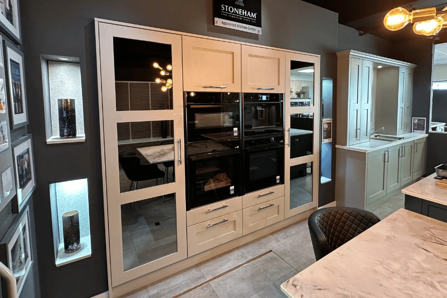 Stoneham shaker kitchen display with ovens and mirrored doors