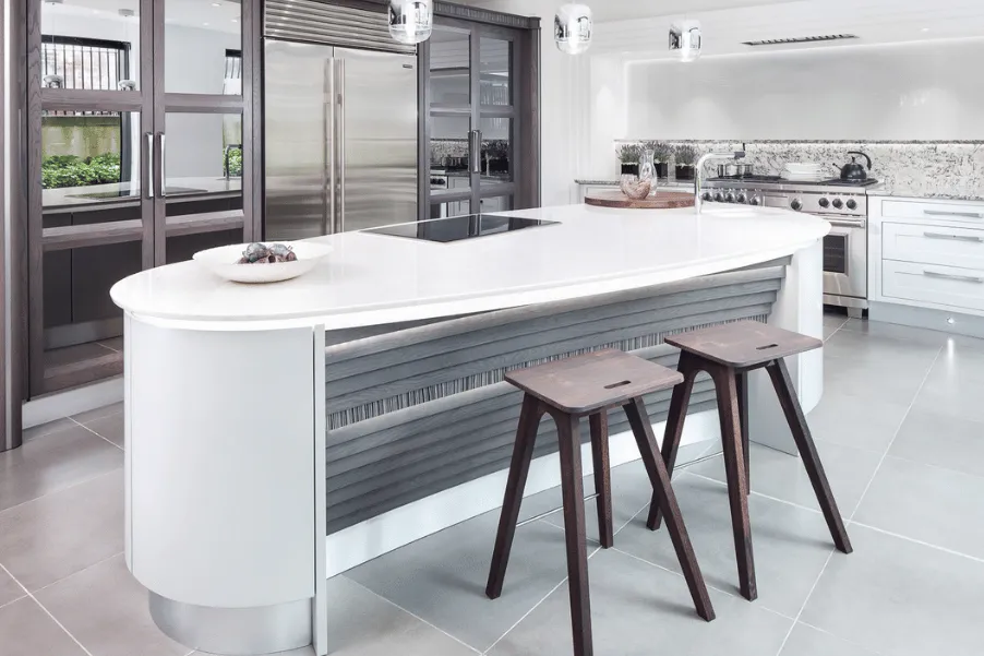 Curved kitchen island with two wooden stools