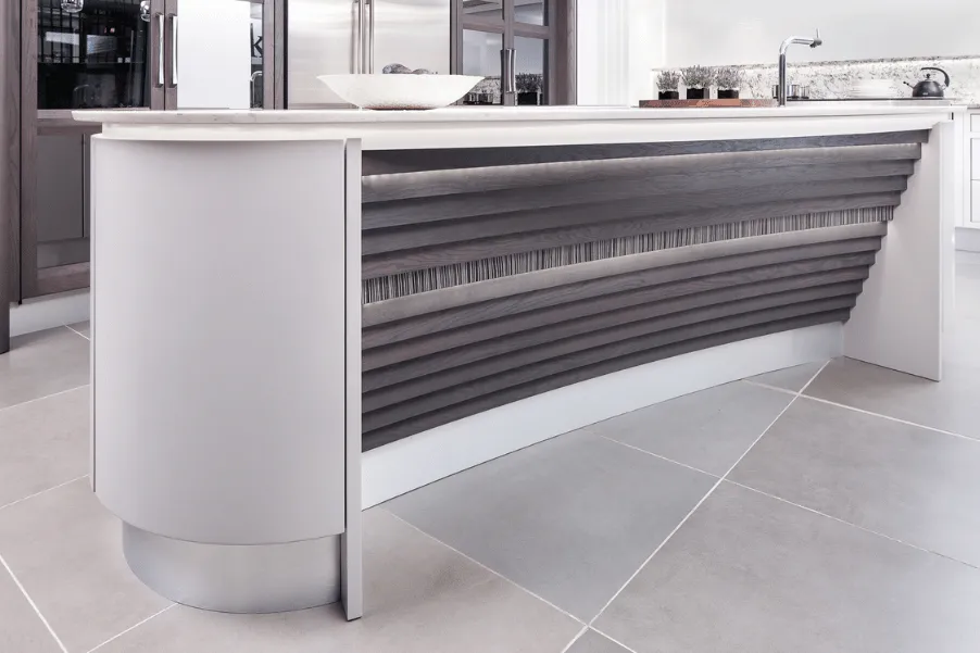 Zebrano accent featured on side of curved kitchen island