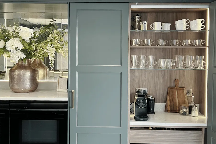 coffee pantry cupboard integrated into green kitchen units