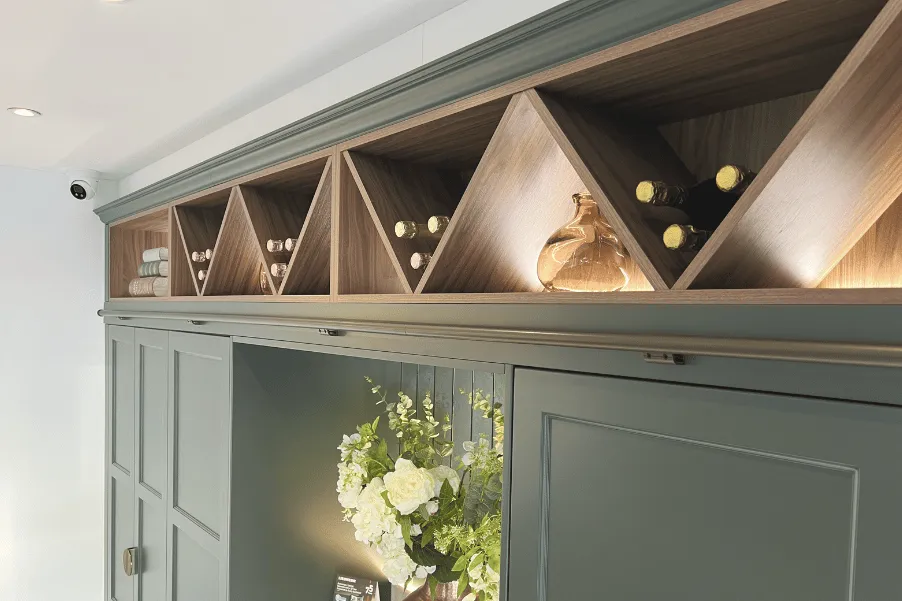 Cruciform shelving at top of kitchen cabinets